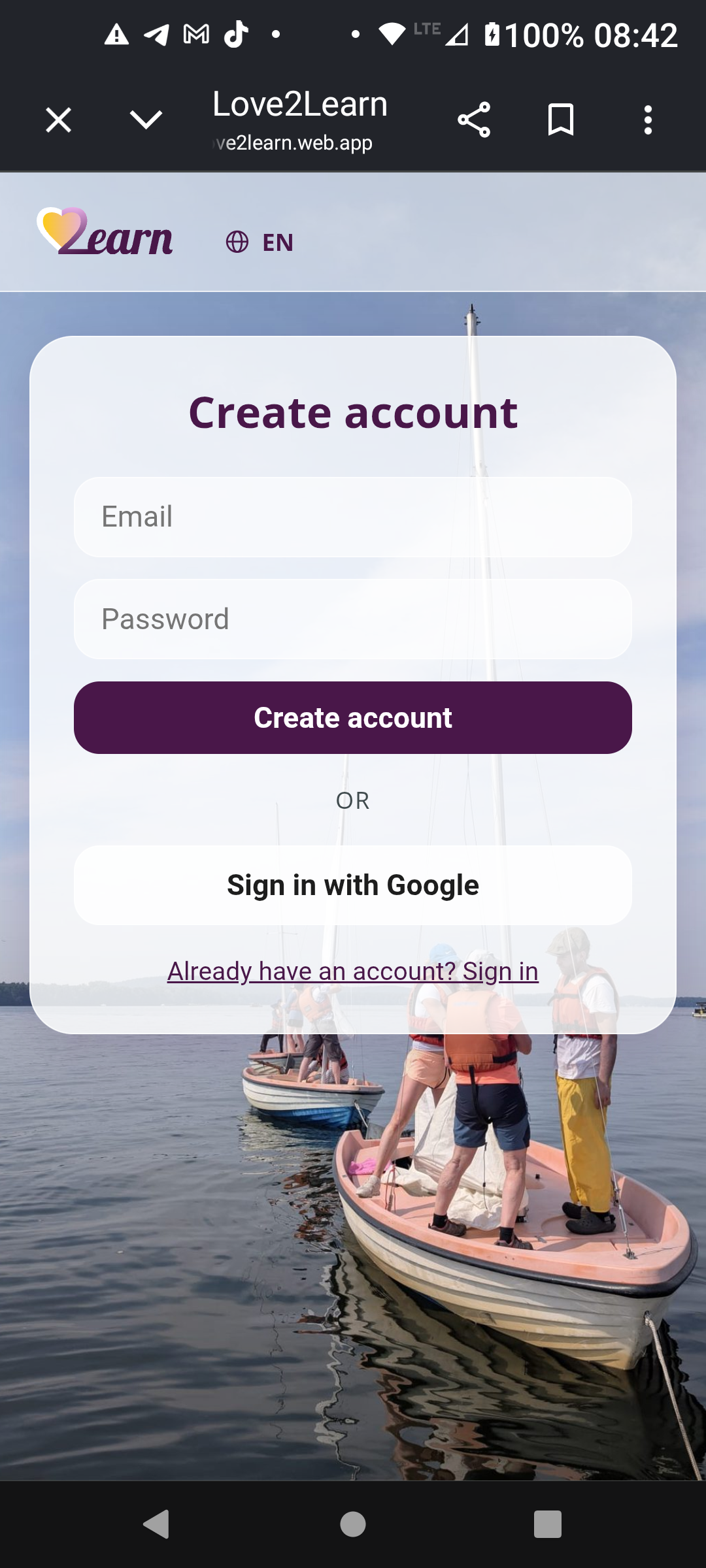 Love2Learn create account screen, same card toggled to sign-up